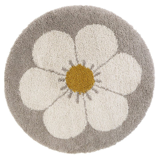 Rond vloerkleed Bohemian Daisy van Nattiot in beige, wit en geel. Hoogpolig en zacht, ideaal voor een schattige kinderkamer of babykamer.