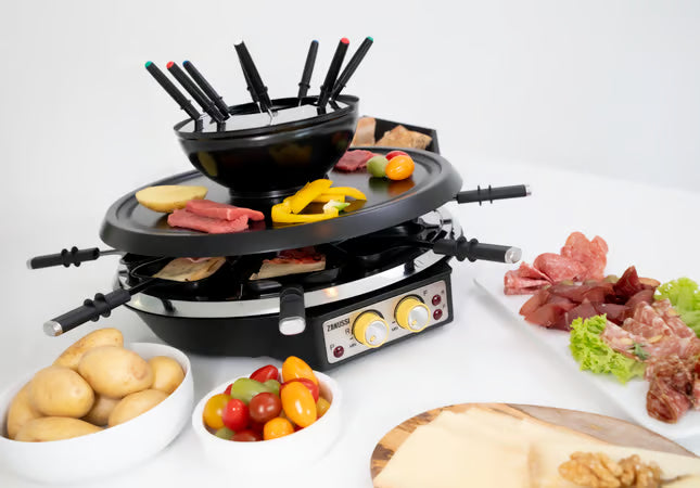 Gebruik van de grillplaat en raclette-pannetjes met verschillende soorten vlees en groenten.