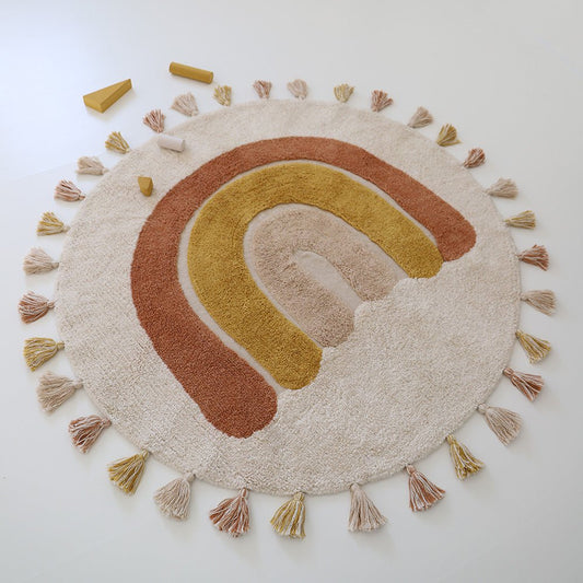 Rond vloerkleed met regenboog in beige, geel en bruin – ideaal voor kinderkamer of babykamer