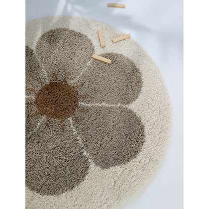 Rond bohemian Daisy vloerkleed in wit en beige voor kinderkamer, babykamer, en peuterkamer.