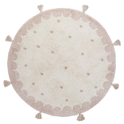 Ronde katoenen vloerkleed in zachte nude roze tinten met tijdloos design, geschikt voor kinderkamers en babykamers.