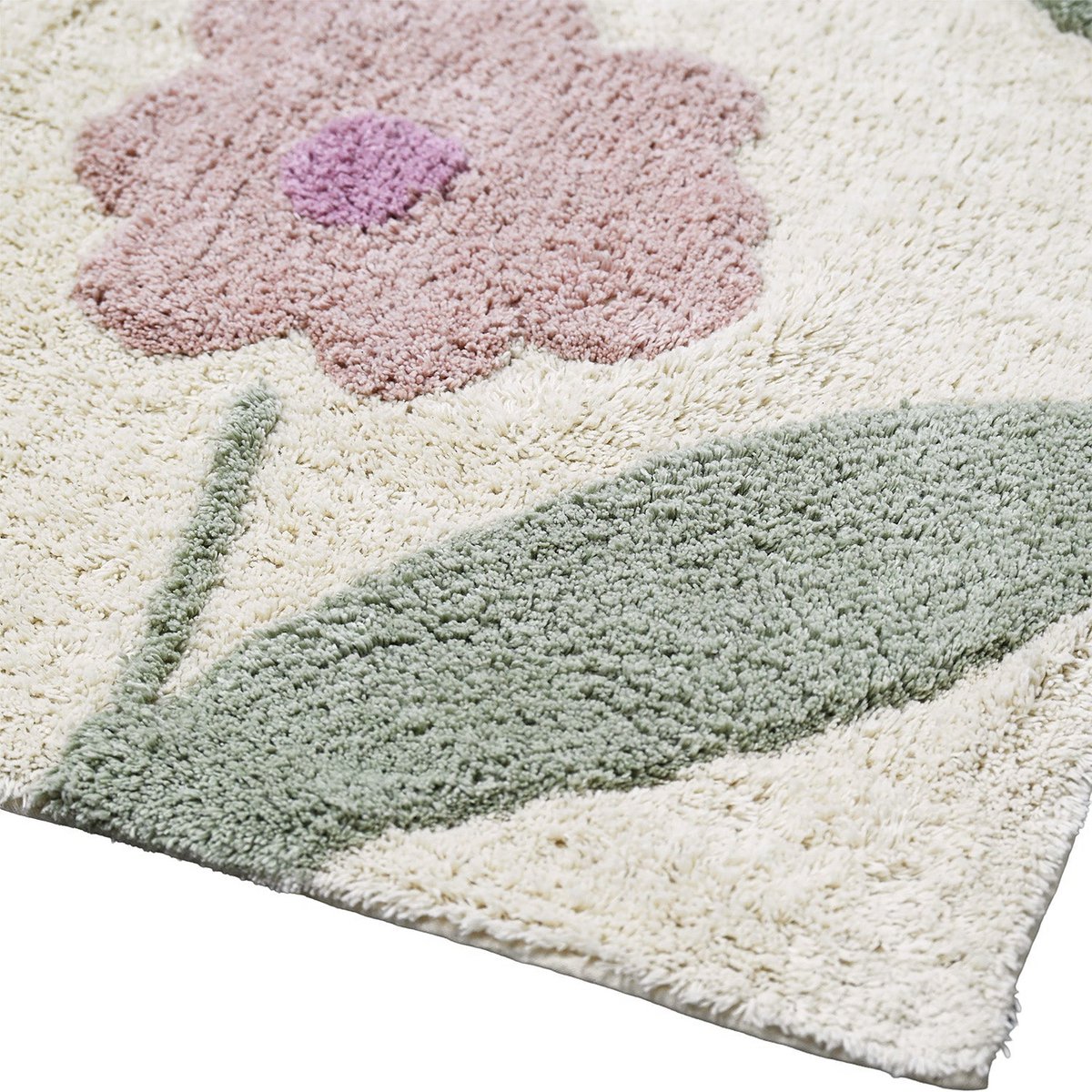 Close-up van de stevige rand- en hoekafwerking van het rechthoekige lila Sunny Flowers vloerkleed.