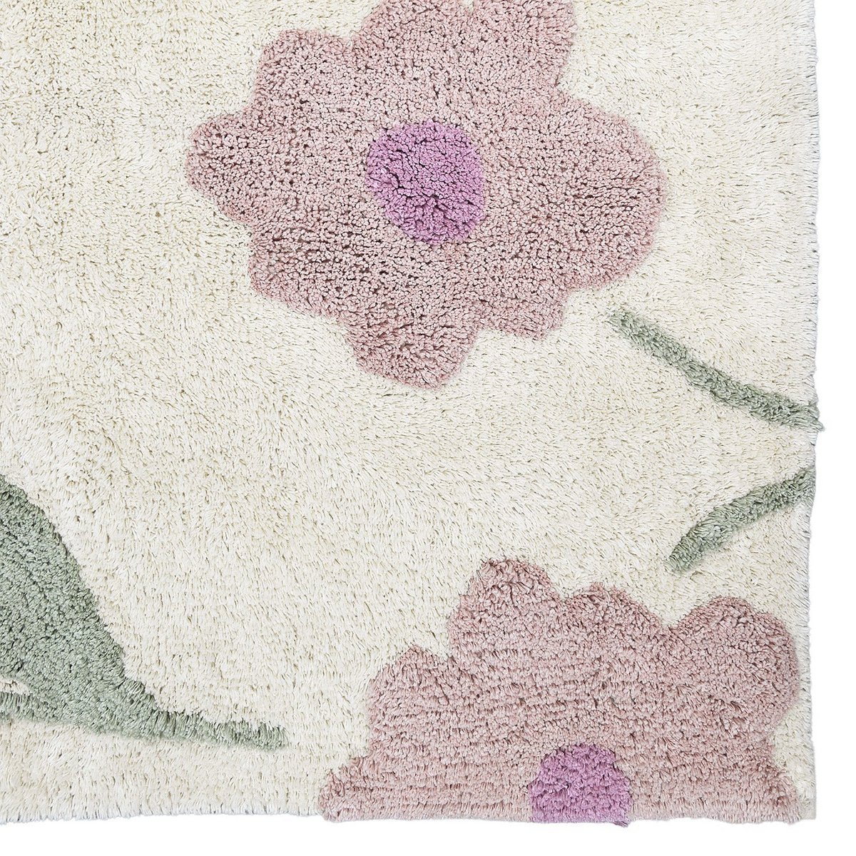 Close-up detail van de zachtpaarse bloemen op het handgemaakte katoenen Sunny Flowers vloerkleed.
